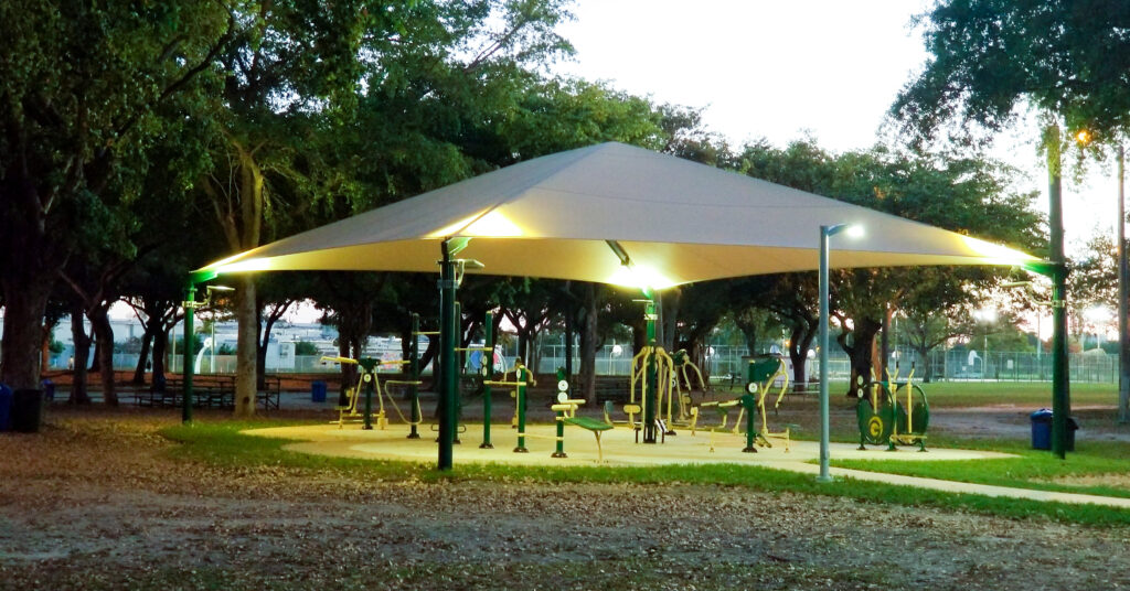 Workout Equipment under shade with lights at night