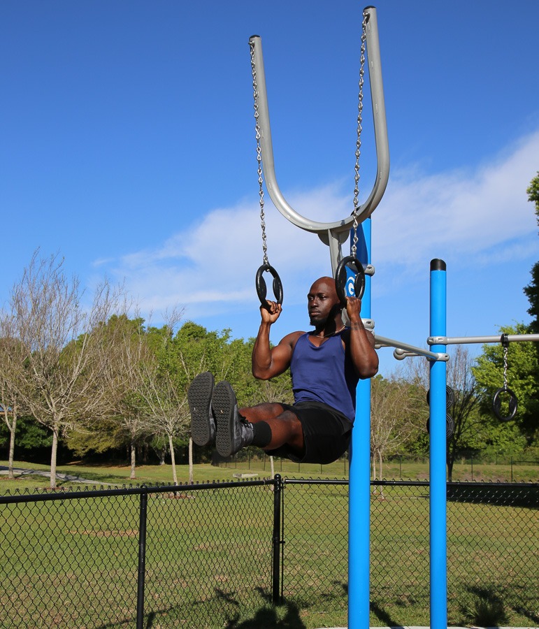 A man using the high rings
