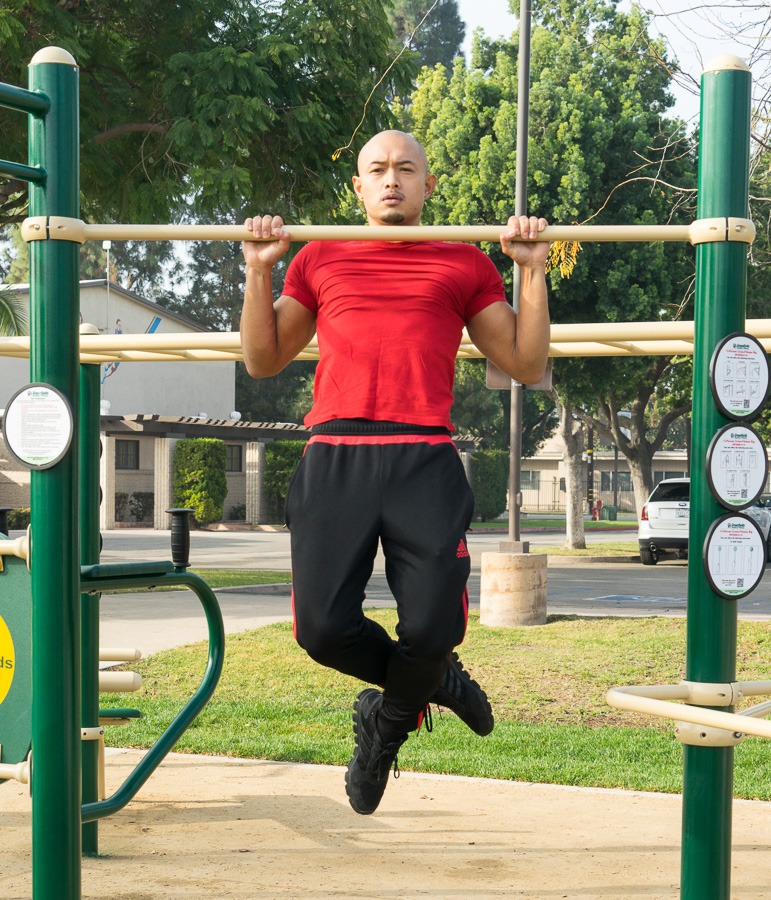 A man doing a pull-up on Pull-Up Bar