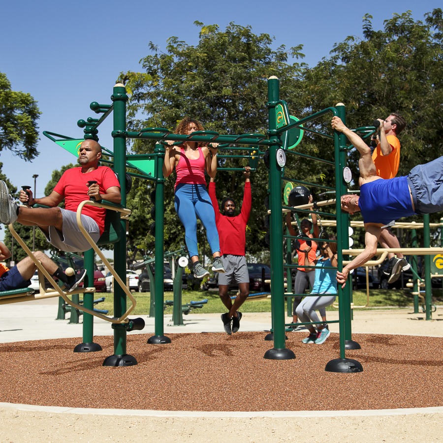 A group of people exercising on the Functional Fitness Rig